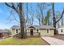 Charming single-story home with a cozy front porch and mature trees in the front yard at 884 Custer Se Ave, Atlanta, GA 30316