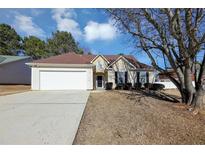 One story house with attached garage and manicured lawn at 533 Halley Way, Stockbridge, GA 30281