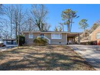 Ranch style home with carport and landscaped yard at 2159 Macon Sw Dr, Atlanta, GA 30315
