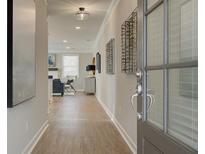 Bright and airy entryway with hardwood floors and views into the living room at 3311 Cranston Ln, Kennesaw, GA 30144