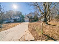 House exterior view with driveway and yard at 1129 Winston Dr, Decatur, GA 30032