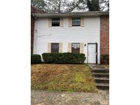 Two-story house with white siding, shutters, and a small front yard at 6354 Shannon Pkwy # 30D, Union City, GA 30291