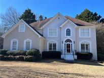 Two-story house with tan siding, white trim, and a manicured lawn at 3525 Fieldstone Xing, Alpharetta, GA 30005