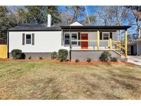 Newly renovated house featuring a modern exterior, landscaped lawn, and a welcoming front porch at 2007 North Nw Ave, Atlanta, GA 30318