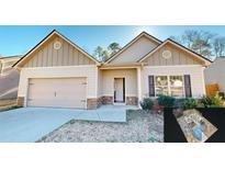 Ranch style home with two-car garage and stone accents at 148 Sourwood Ln, Temple, GA 30179