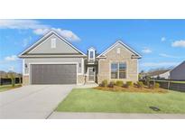Brick and shingle one-story home with a two-car garage at 2798 Turnwater St, Hoschton, GA 30548