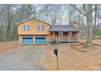 Ranch style home with attached garage and covered porch at 2333 Targa Sw Ln, Marietta, GA 30064