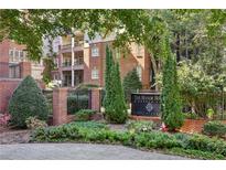 Beautifully landscaped entrance to The Manor House condominium complex on Fifty Biscayne at 50 Biscayne Dr # 2109, Atlanta, GA 30309
