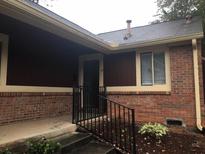 Brick ranch home with a covered entry and small front yard at 33 Country Place Ct, Alpharetta, GA 30005