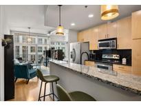 Modern kitchen with stainless steel appliances and granite countertops at 943 Peachtree Ne St # 809, Atlanta, GA 30309