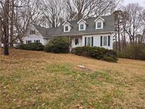 Two story house with white siding and a gray roof, sitting on a grassy lot at 105 Pine Valley Rd, Hiram, GA 30141