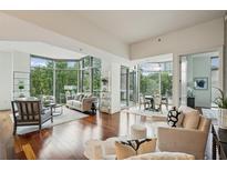 Spacious living area with hardwood floors, large windows, and ample natural light at 2795 Peachtree Ne Rd # 401, Atlanta, GA 30305