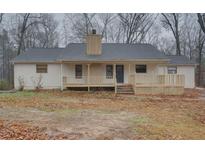 Ranch style home with a front porch and large backyard at 5520 Hearn Rd, Ellenwood, GA 30294