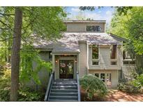 Two-story house with gray siding, double doors, and a gray staircase at 5090 Nesbit Ferry Ln, Atlanta, GA 30350