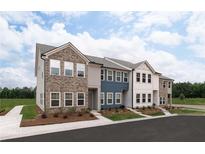 Three-unit townhome building, brick and siding exterior, landscaping at 2114 Stillhaven Pl, Douglasville, GA 30135