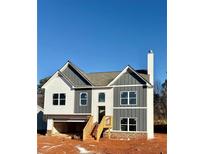 Two-story house with gray and white siding, a wooden staircase, and a partially visible attached garage at 478 Charleston Pl, Villa Rica, GA 30180