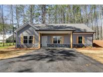 Gray exterior with stone accents and a covered porch at Tract1 Harmony Rd, Temple, GA 30179