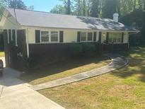 Brick ranch house with a large yard and walkway at 2362 Maxwell Sw Dr, Atlanta, GA 30311