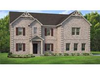 Two-story brick home with a large front yard and brown shutters at 121 Frontier Way, Mcdonough, GA 30253