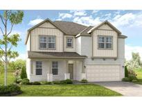 Two-story home with light brick and vinyl siding, a two-car garage and landscaping at 525 Nolden Trl, Dacula, GA 30019
