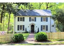 Charming two-story house with white exterior,navy shutters, and manicured lawn at 500 Westover Nw Dr, Atlanta, GA 30305
