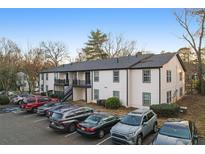 Two-story building with ample parking and mature trees at 3599 Woodbriar Cir # G, Tucker, GA 30084