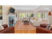 Spacious living room with fireplace and hardwood floors at 28317 Plantation Ne Dr, Atlanta, GA 30324