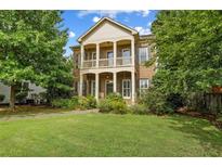 Brick two-story house with a large front yard and balcony at 3241 Adams St, Atlanta, GA 30337