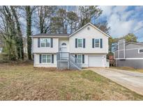 Two-story house with white siding, gray trim, and a front yard at 3446 Newberry Trl, Decatur, GA 30034
