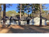 Charming single-story home with a welcoming front yard and mature trees at 35 Fairfield Dr, Ellenwood, GA 30294