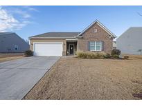 Brick ranch home with attached garage and landscaping at 4680 Alford, Cumming, GA 30028