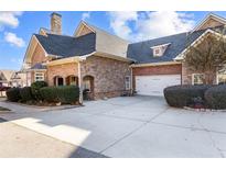Attractive brick home with a two-car garage and manicured landscaping at 2101 Legacy Park Dr, Lithia Springs, GA 30122