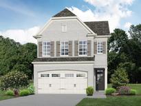 Two-story home with gray brick, white garage doors, and landscaping at 4150 Cavalier Way, Duluth, GA 30097