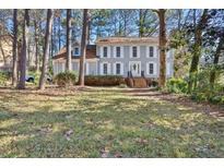 Two-story house with gray siding, white shutters, and a brick staircase at 872 Brafferton Pl, Stone Mountain, GA 30083