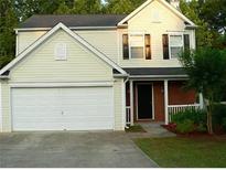 Two-story house with attached garage and landscaping at 517 Carrington Ct, Canton, GA 30115