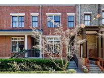 Brick townhome with front porch and landscaping at 4724 Cypress Commons # 702, Atlanta, GA 30338
