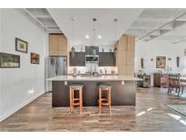 Modern kitchen with stainless steel appliances and island at 805 Peachtree St # 515, Atlanta, GA 30308