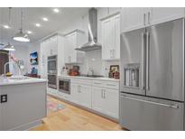 Modern kitchen with stainless steel appliances and white cabinetry at 1007 Katie Kerr Dr, Decatur, GA 30030