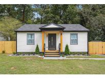 Newly renovated home with a charming front porch and fenced yard at 2082 Perkerson Sw Rd, Atlanta, GA 30310