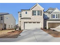 Two-story brick home with a two-car garage and landscaping at 4182 Waratah Way, Mableton, GA 30126
