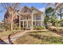 Two-story house with front yard, walkway, and balcony at 935 Piedmont Ave # 201, Atlanta, GA 30309