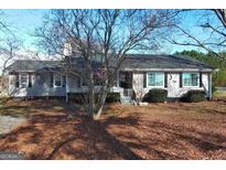 Ranch house with mature trees and a spacious yard at 1349 Highway 81 E, Mcdonough, GA 30252