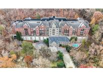 Luxury condo building with pool and courtyard; beautiful wooded setting at 3280 Stillhouse Se Ln # 410, Atlanta, GA 30339