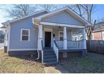 Charming gray house with a front porch and steps at 967 Metropolitan Sw Pkwy, Atlanta, GA 30310