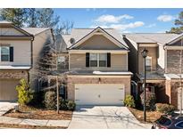 Two-story townhome with neutral tones and a two-car garage at 286 Staley Drive, Tucker, GA 30084