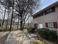 Charming two-story home with classic siding, red shutters, and well-maintained landscaping at 6354 Shannon Pkwy # 2A, Union City, GA 30291