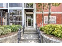 Brick building with gated parking and large windows at 505 Whitehall Sw St # 101, Atlanta, GA 30303