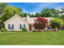 Ranch style home with landscaped yard and spacious lawn at 627 Honey Creek Rd, Mcdonough, GA 30252