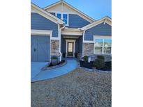 Curb appeal abounds in this charming home featuring stone accents and a welcoming front porch at 532 Barlow Pl, Grayson, GA 30017