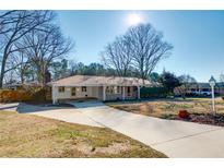 Ranch house with a large yard and driveway at 2833 Alan Sw Dr, Marietta, GA 30064